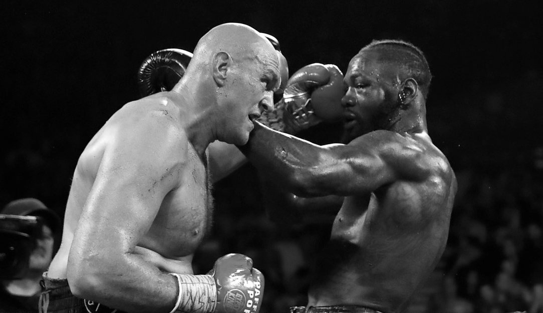 Tyson Fury and Deontay Wilder exchange blows